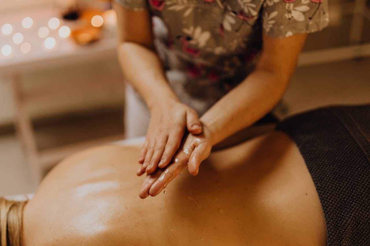Hands massaging a person
